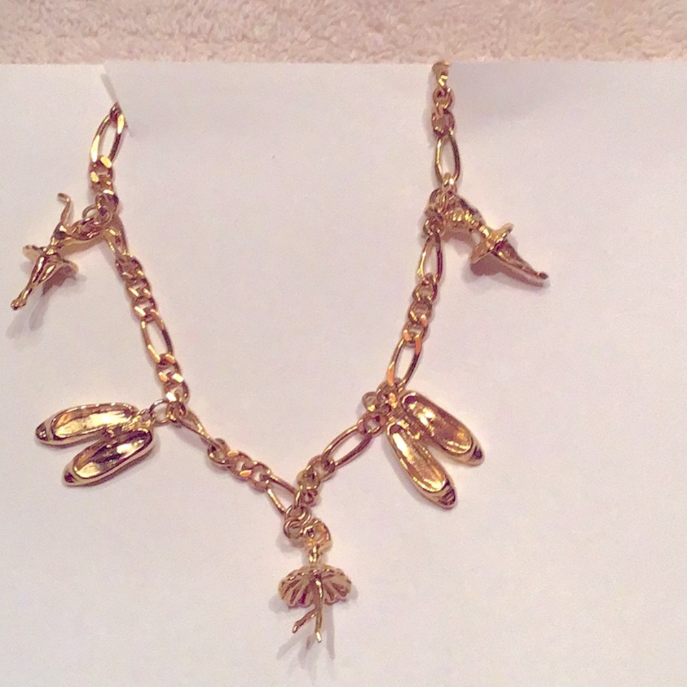 New Ballerina Bracelet. Goldtone, with 5 charms.